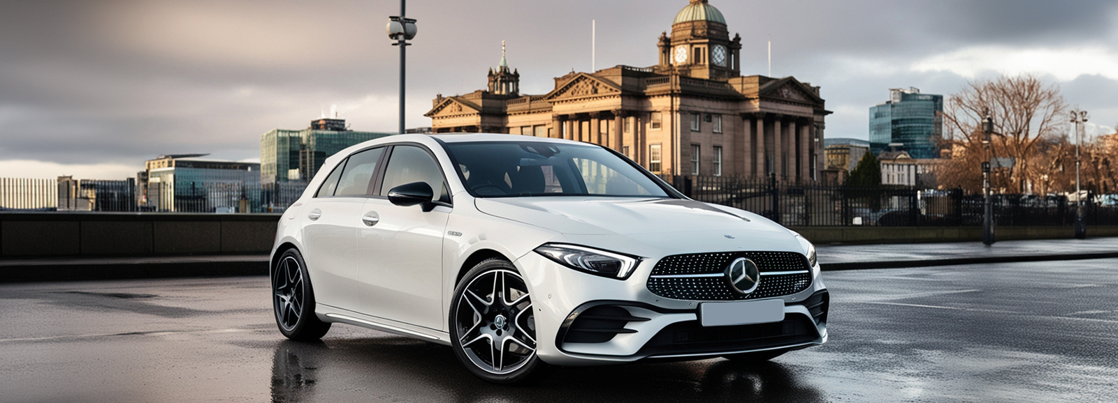 A White Mercedes A-Class Luxury Car parked next to an old Glasgow monument